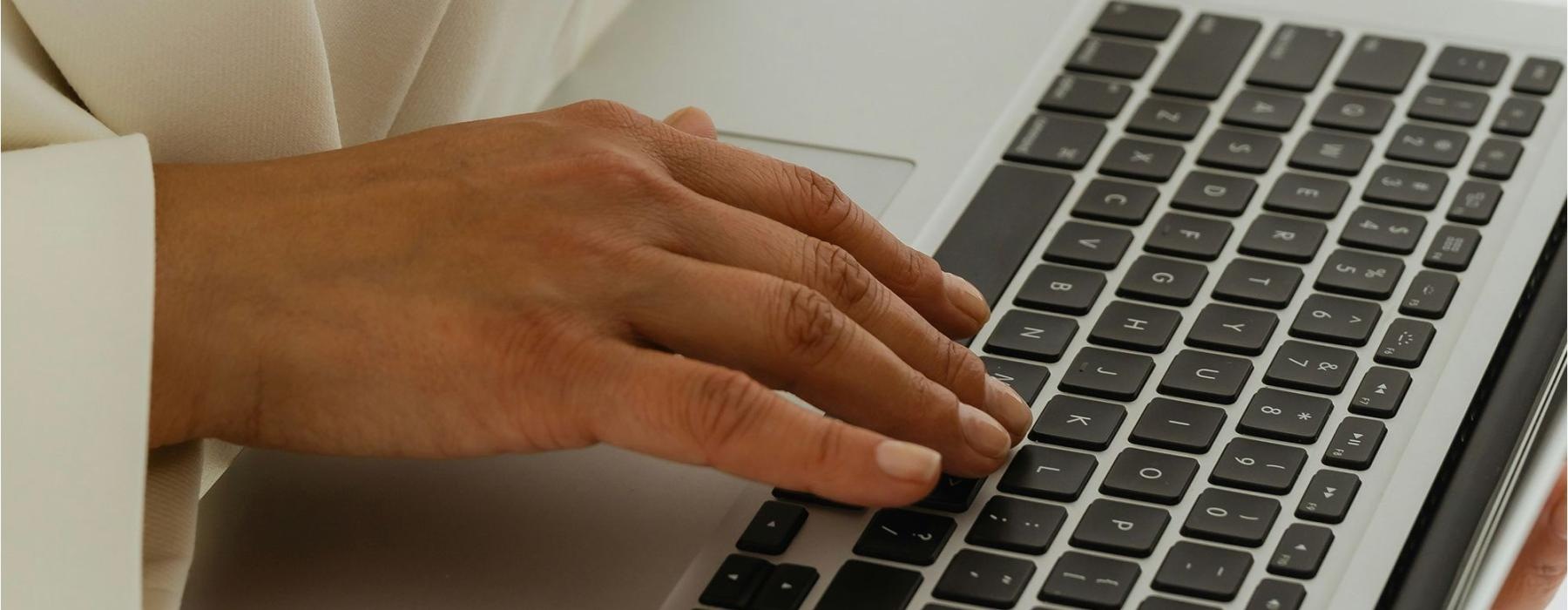 a person typing on a laptop