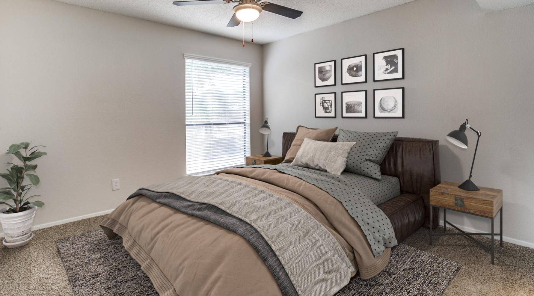 a bedroom with a bed and a fan