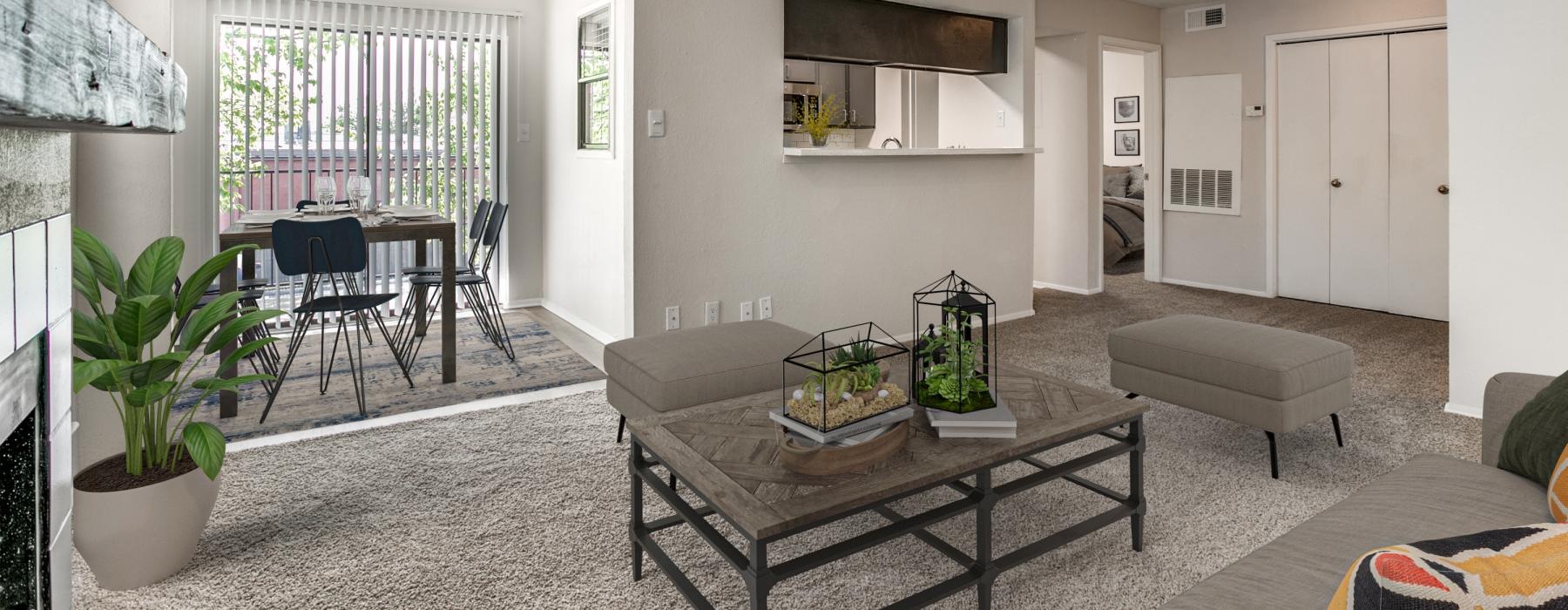 a living room with a table and chairs