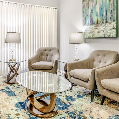 Beautiful living areas to match your lifestyle a living room with a rug and chairs