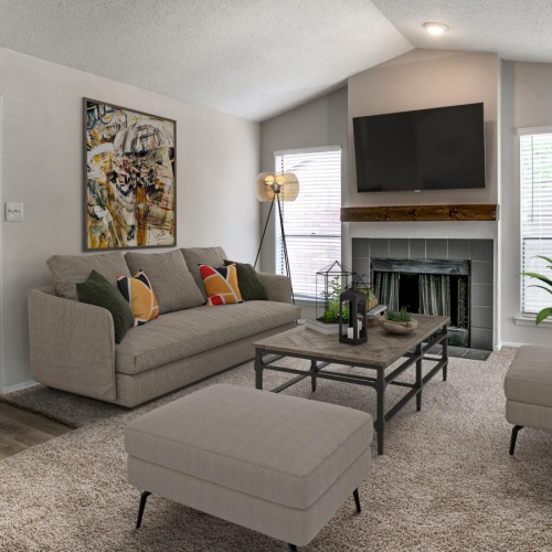 Generous living spaces to relax and unwind a living room with a fireplace a couch and a tv